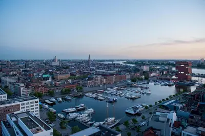 a view of a harbor with boats in the water at Exclusieve privé wellness penthouse SkyNooz in Antwerp