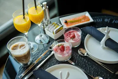 a tray with glasses of food and drinks on a table at Exclusieve privé wellness penthouse SkyNooz in Antwerp