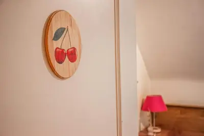 a picture of two red hearts on a wall at B&B La Ferme de l'Hosté in Wavre