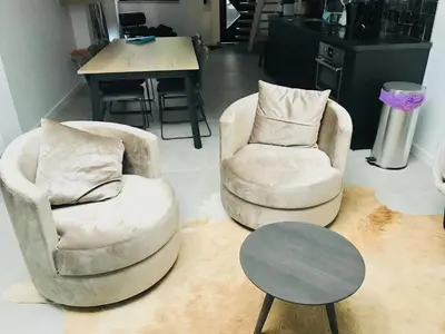 two chairs and a table in a living room at LivingTheMoment in Ghent