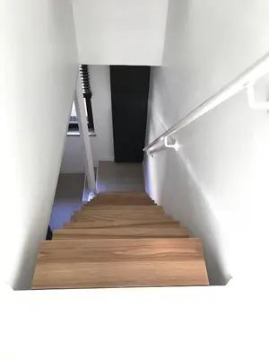 a staircase in a house with wooden floors at LivingTheMoment in Ghent
