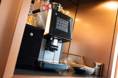 a coffeemaker with a coffee maker in a kitchen at B&B HOTEL Antwerpen Zuid in Antwerp