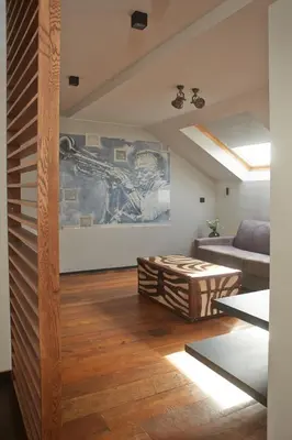 a living room with a couch and a table at Boutique Hotel Saint-Géry in Brussels