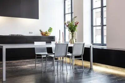 a dining room with a white table and chairs at Josie in Ghent