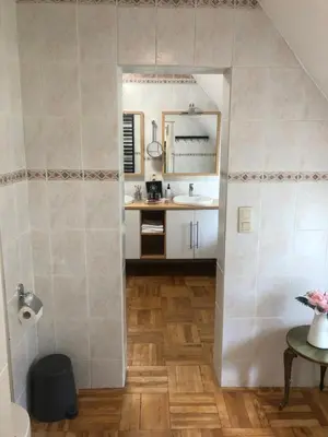 a kitchen with a sink and a counter at Rose House B&B in Ghent