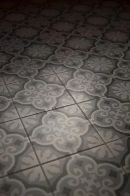a tile floor with a design on it at Antonine's Atelier in Hingene
