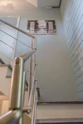 a staircase in a building with a picture on the wall at Antonine's Atelier in Hingene