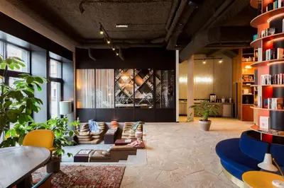 a large living room with couches and chairs at YUST Antwerp in Antwerp