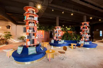 a room with two towers with tables and chairs at YUST Antwerp in Antwerp
