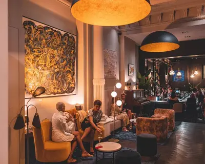a group of people sitting in a room at Harmon House - Hotel & Spa in Brussels