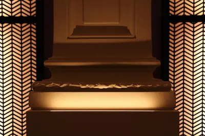 a white column in a room with a patterned curtain at Harmon House - Hotel & Spa in Brussels