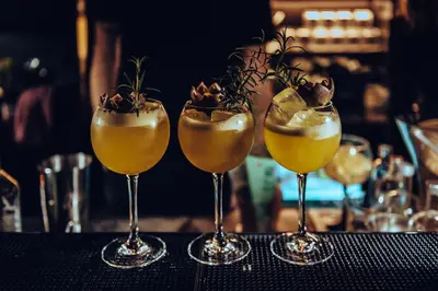 a group of four cocktails sitting on a table at Harmon House - Hotel & Spa in Brussels