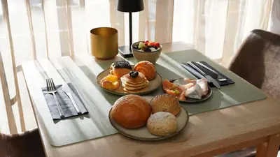 a table with two plates of pastries on it at Hotel Lepelbed in Ghent