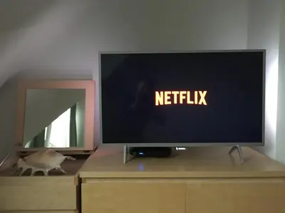 a television sitting on top of a dresser at Rétro Studio in Brussels