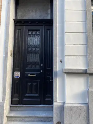 a black door on the side of a building at Rétro Studio in Brussels
