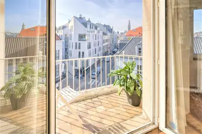 a balcony with a view of a city at Penth A Apartment in Heart of Antwerp in Antwerp