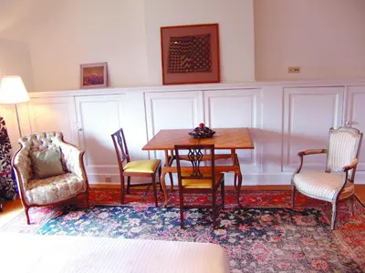 a dining room with a table and chairs at Louise Chatelain suites in Brussels