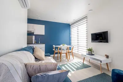 a living room with a couch and a table at Studio Brussels Airport - North in Zaventem