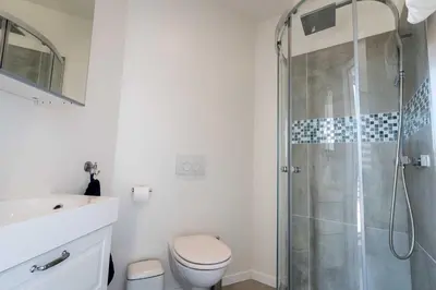 a bathroom with a shower and a toilet and a sink at Studio Brussels Airport - North in Zaventem
