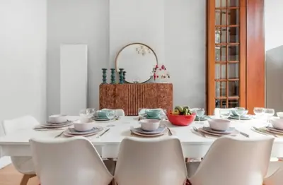 a white dining room table with chairs and a mirror at Flemishome, The Retreat For Family And Friends in Halle