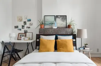 a bedroom with a bed with yellow pillows and a desk at Flemishome, The Retreat For Family And Friends in Halle