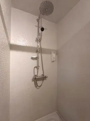 a shower in a bathroom with a bath tub at Guesthouse La maison de Fille in Diest