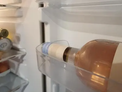 a bottle of sauce in an open refrigerator at Guesthouse La maison de Fille in Diest