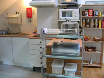 a kitchen with a sink and a counter top at Huize Rafael in Leuven