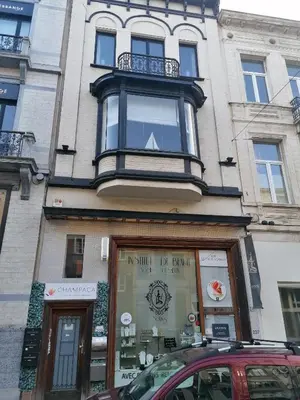 a building with a window on top of it at Brugmann Loft Apartment in Brussels