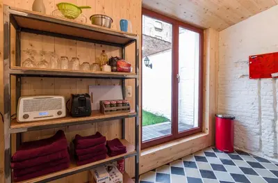 a room with a book shelf and a window at Romantic 16th century workers house in Ghent