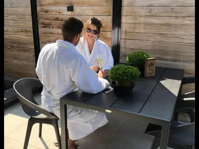 a man and a woman sitting at a table at Lusandre in Olen