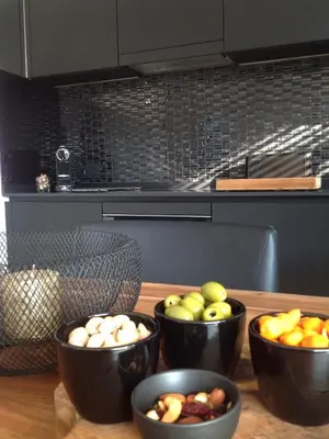 a table with bowls of fruits and vegetables on it at Lusandre in Olen
