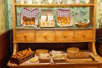 a shelf filled with lots of different types of food at Hotel Rubenshof in Antwerp