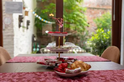 a table with two plates of food on a table at Hotel De Pastorij in Leuven