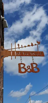 a sign that says bc on a pole at Hof ter Dreef in Meise