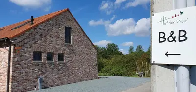 a brick building with a bbc sign next to it at Hof ter Dreef in Meise