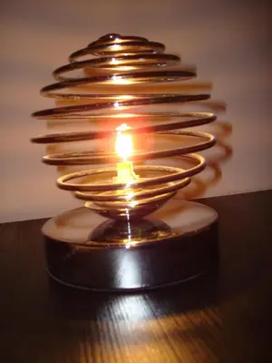 a lit candle in a glass bowl on a table at Brigitte & Alain in Brussels