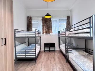 a room with three bunk beds in it at Sint-Jans Appartments in Antwerp