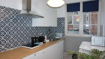 a kitchen with a counter with a sink and a microwave at Sint-Jans Appartments in Antwerp