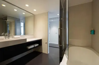 a bathroom with a shower and a sink at B-aparthotel Regent in Brussels