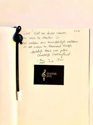 a handwritten letter with a pen on a piece of paper at Foodiejive in Antwerp