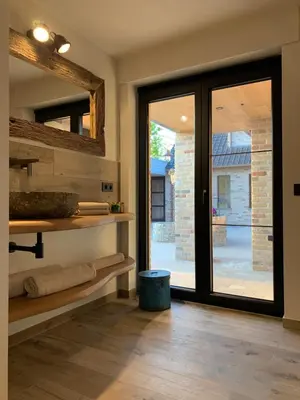 a room with a sliding glass door and a patio at Vakantiewoning 't Rysselhof in Kaprijke