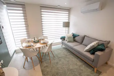 a living room with a couch and a table at Studio Brussels Airport - EU-District in Zaventem