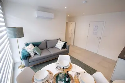 a living room with a couch and a table at Studio Brussels Airport - EU-District in Zaventem
