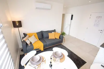 a living room with a couch and a table at Studio Brussels Airport - South in Zaventem