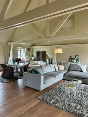 a living room with a couch and a table at The Loft in Melsele