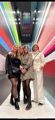 a group of women standing in front of a wall at The Loft in Melsele