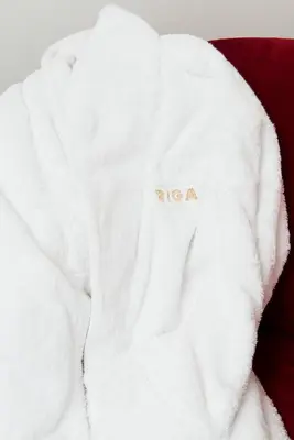 a white sweater with the word niagara on it at Hotel Riga in Antwerp