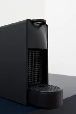 a black computer monitor sitting on top of a table at Hotel Riga in Antwerp