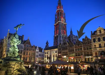 a group of buildings with a clock tower at Antwerp old town triplex apartment in Antwerp